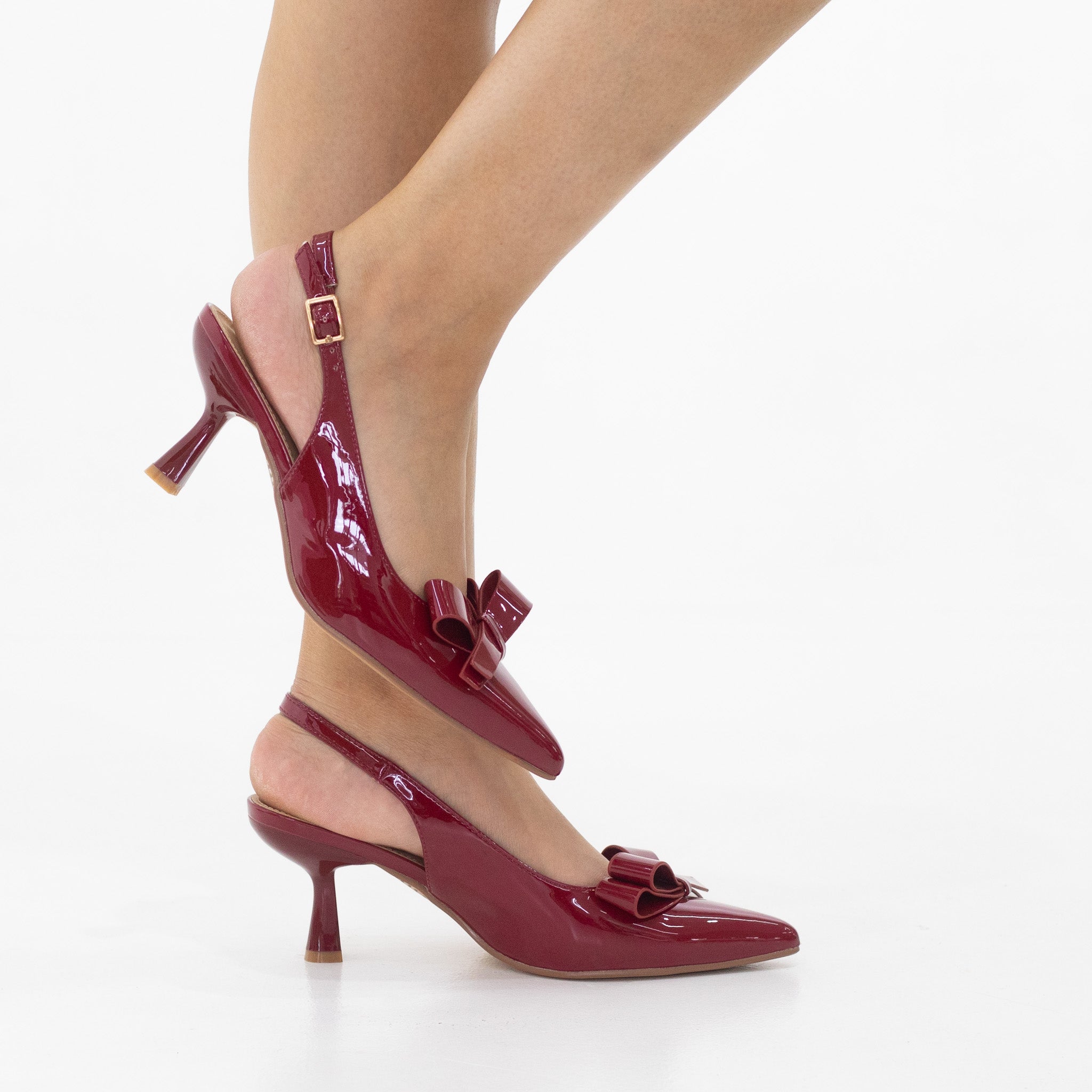 Rejaf pointy patent sling back courts with knot trim on 7cm heel