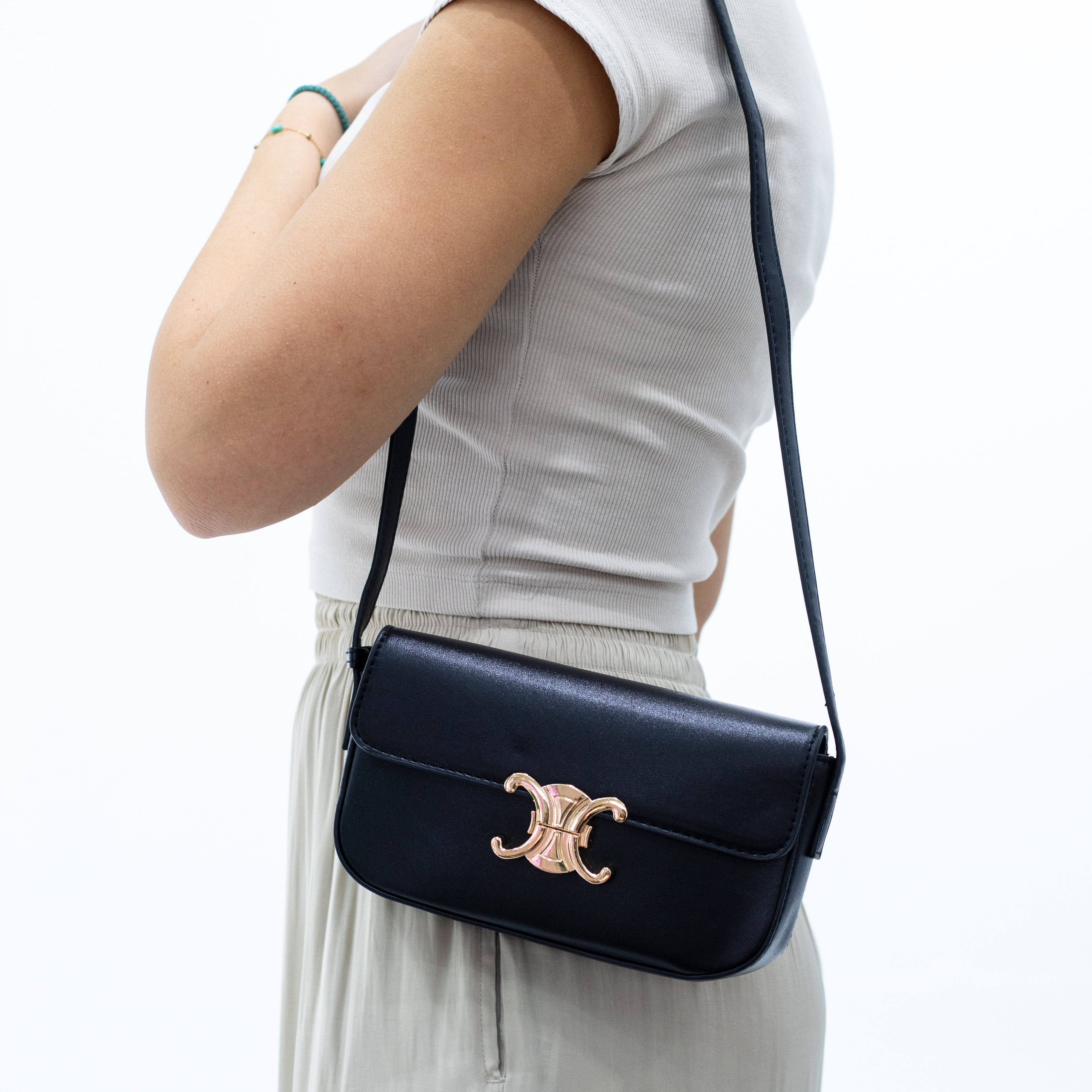 Misa buffalo skull trim mini clutch bag black