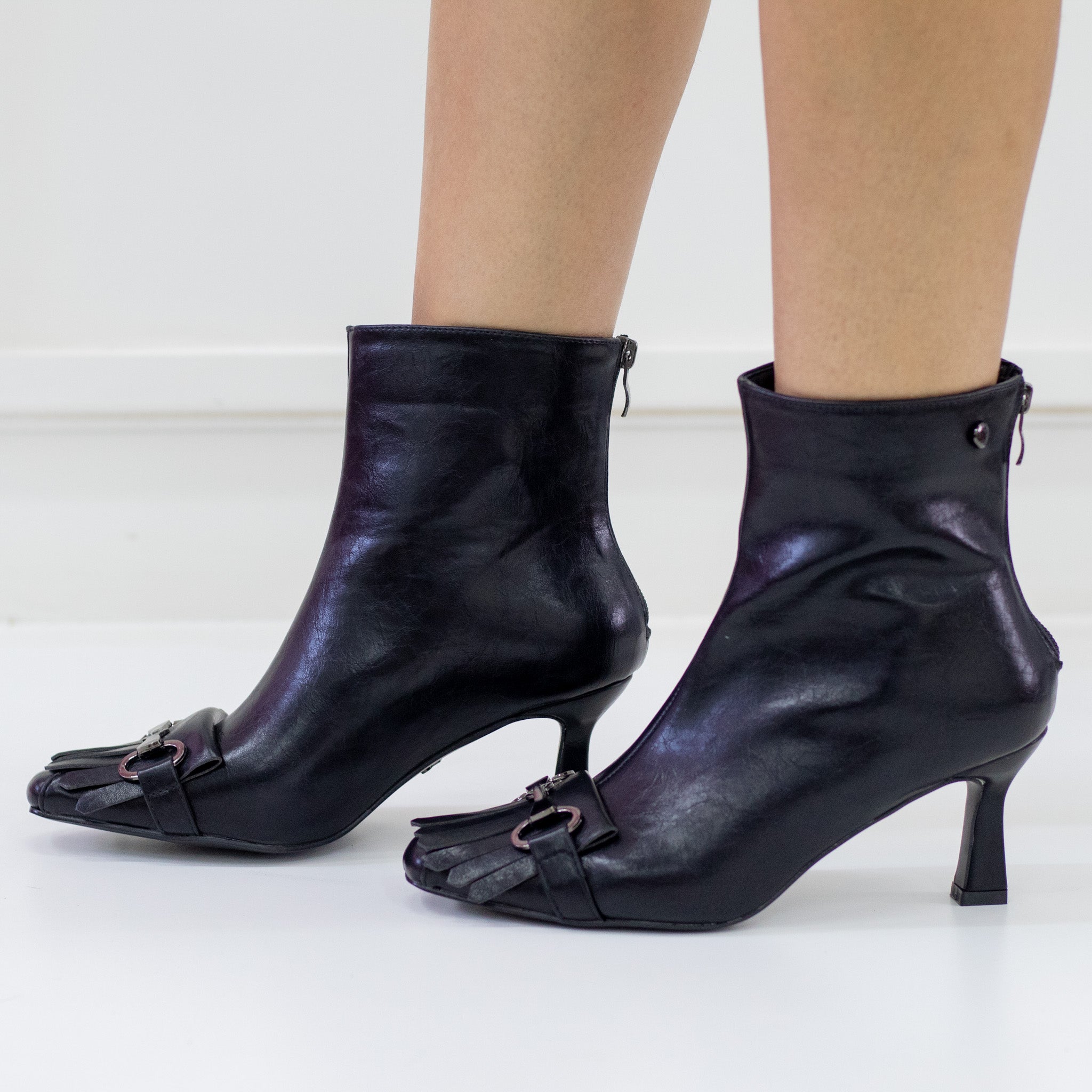 Black 7cm heel square toe bootie with tassel trim shot