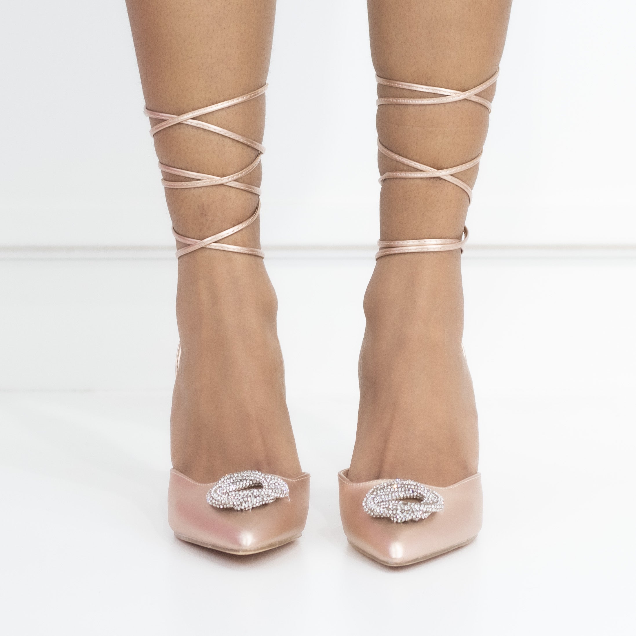 Cupid tie up pointy heel with a round diamond trim champagne