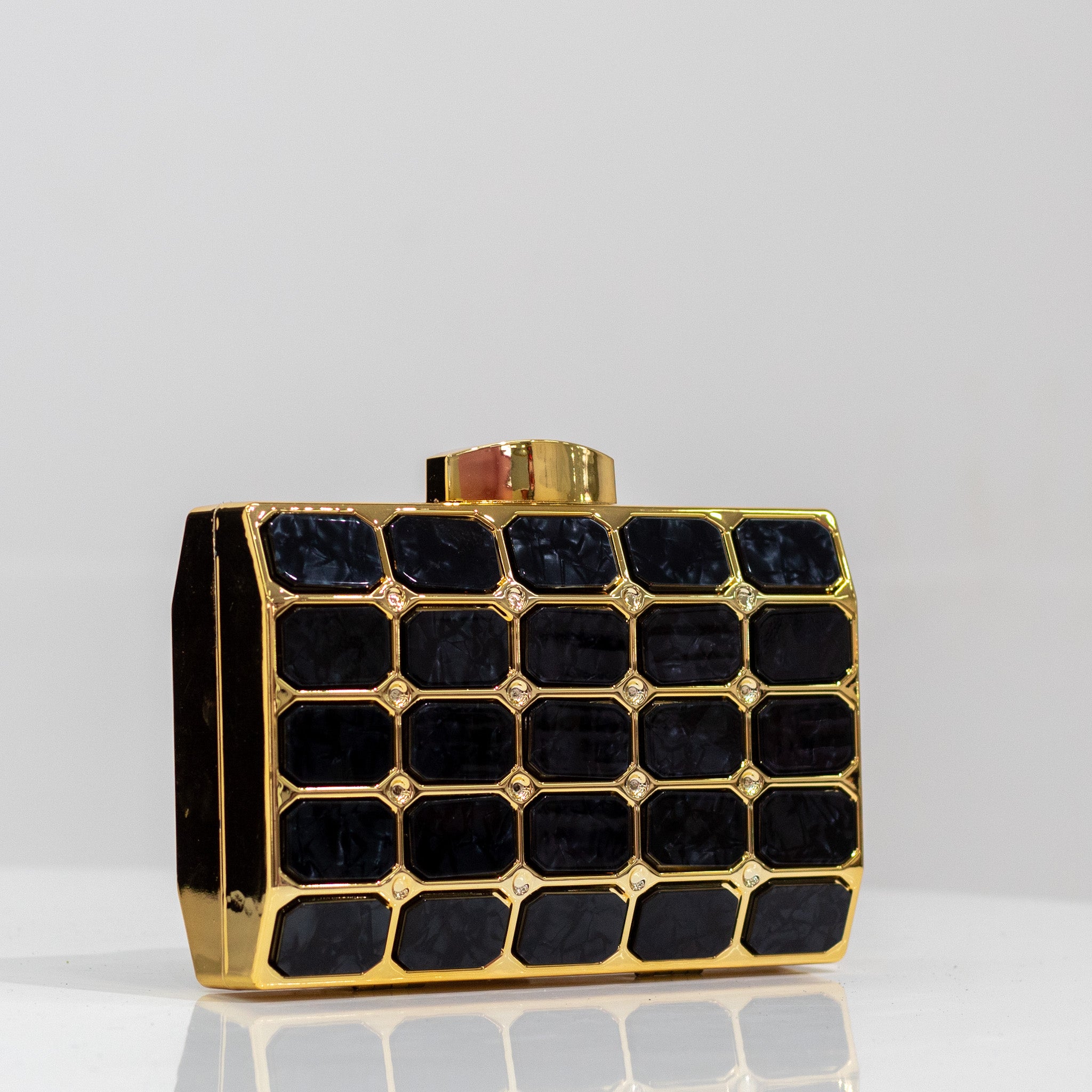 Xeno tiled detailed capsule clutch bag black