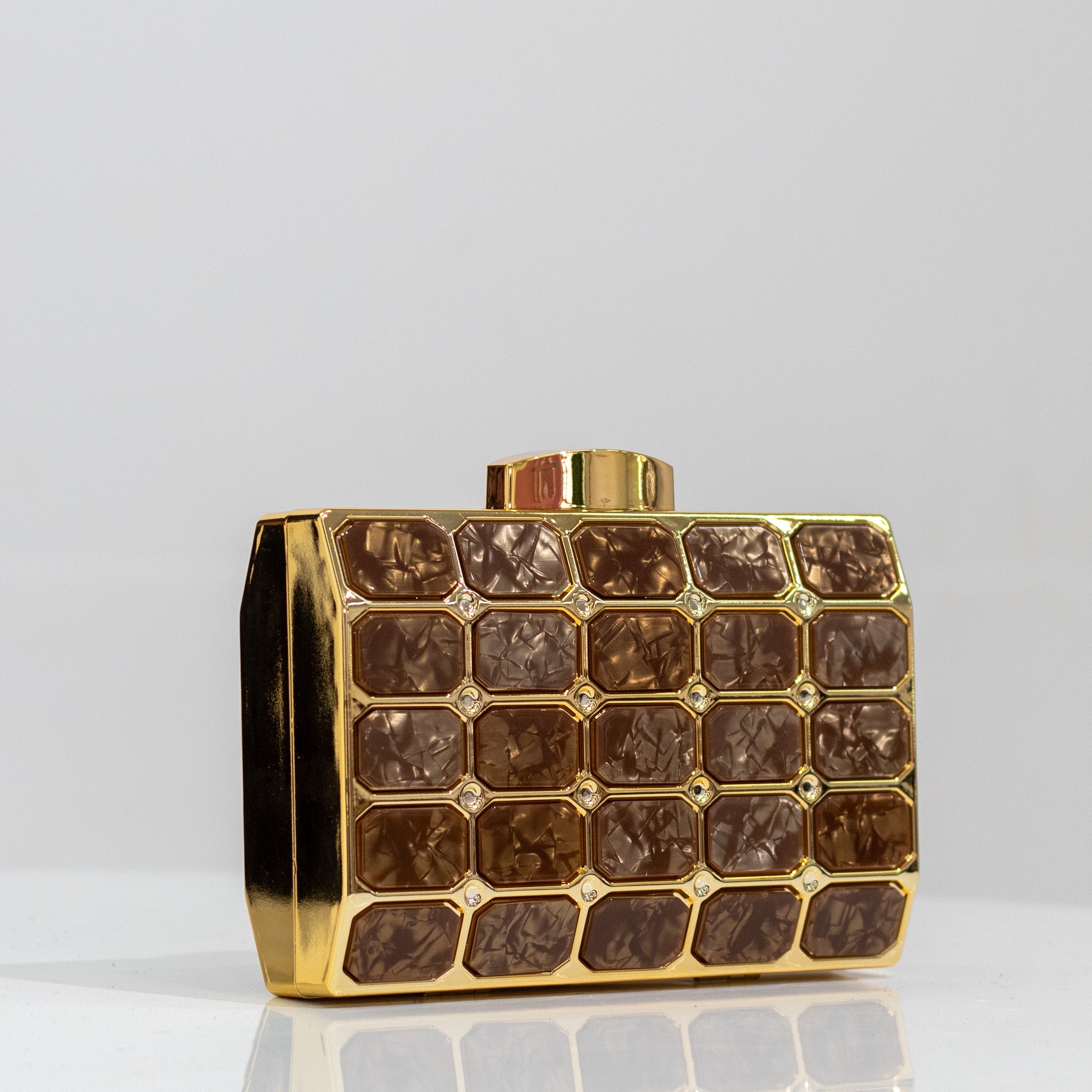 Xeno tiled detailed capsule clutch bag gold