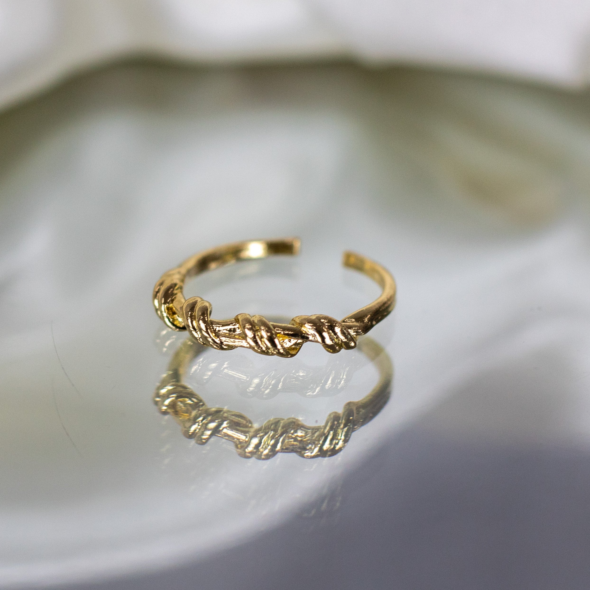 Gold twist ring