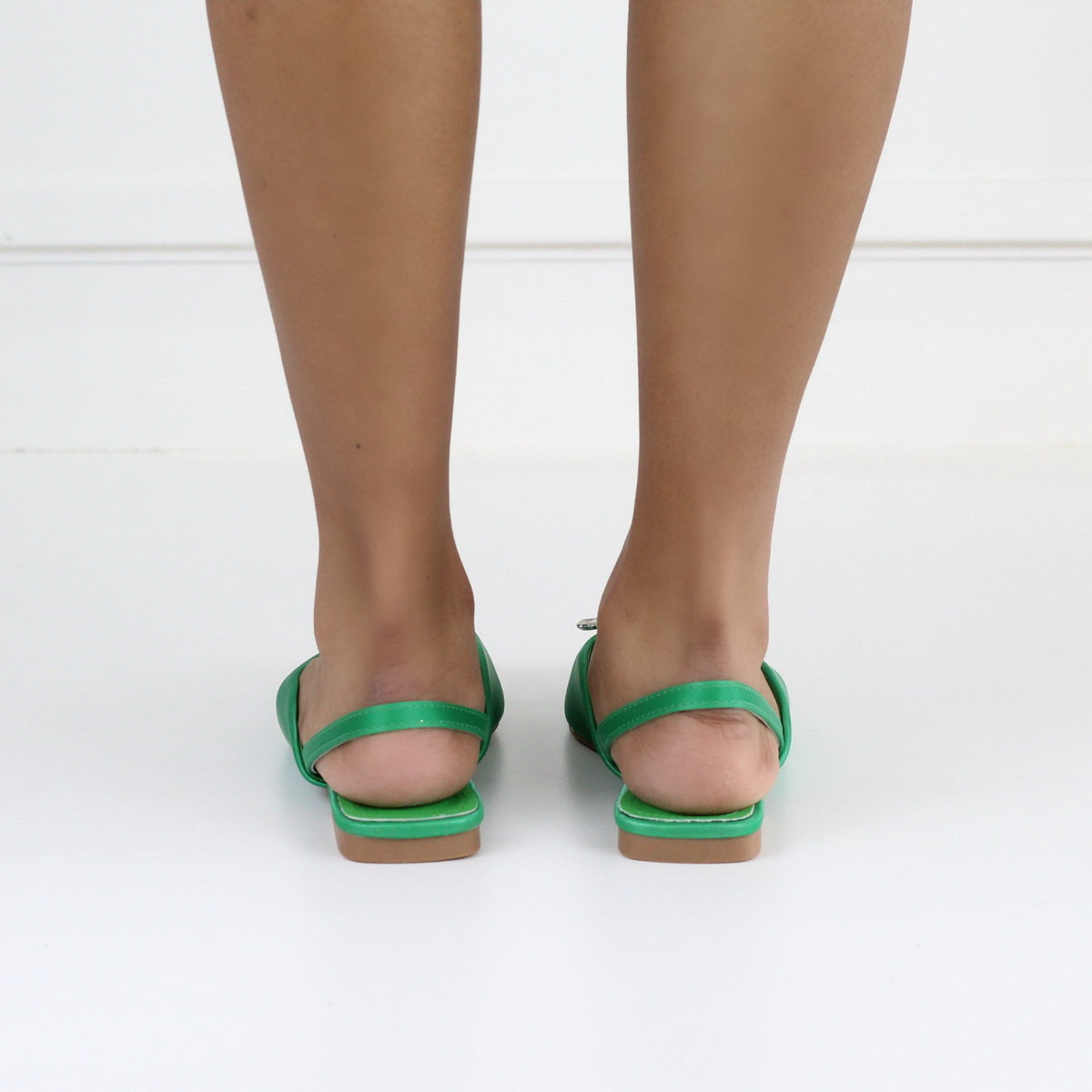 Erina pointy sling back pump with a trim green