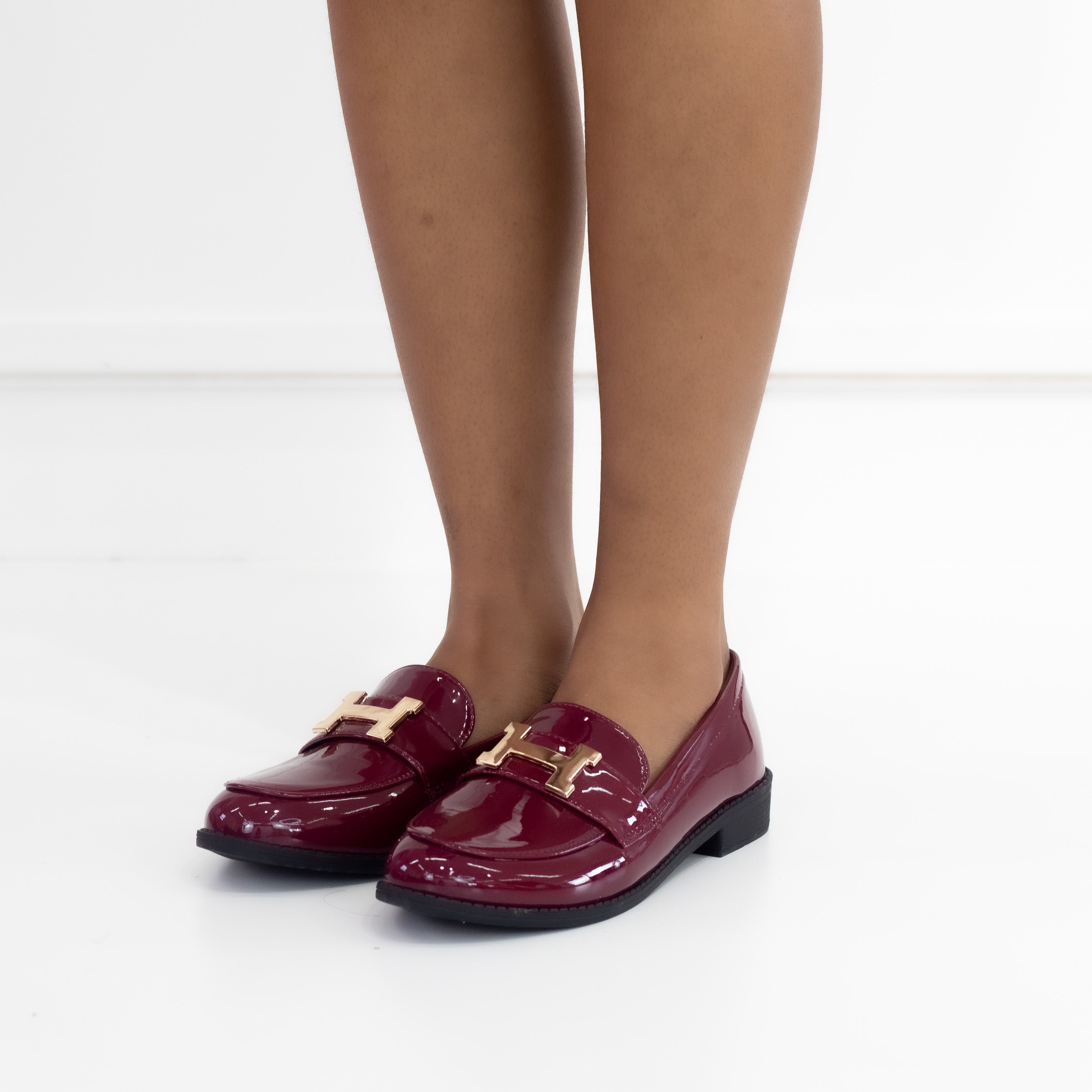 Mishal flat loafer in pat pu with gold trim wine