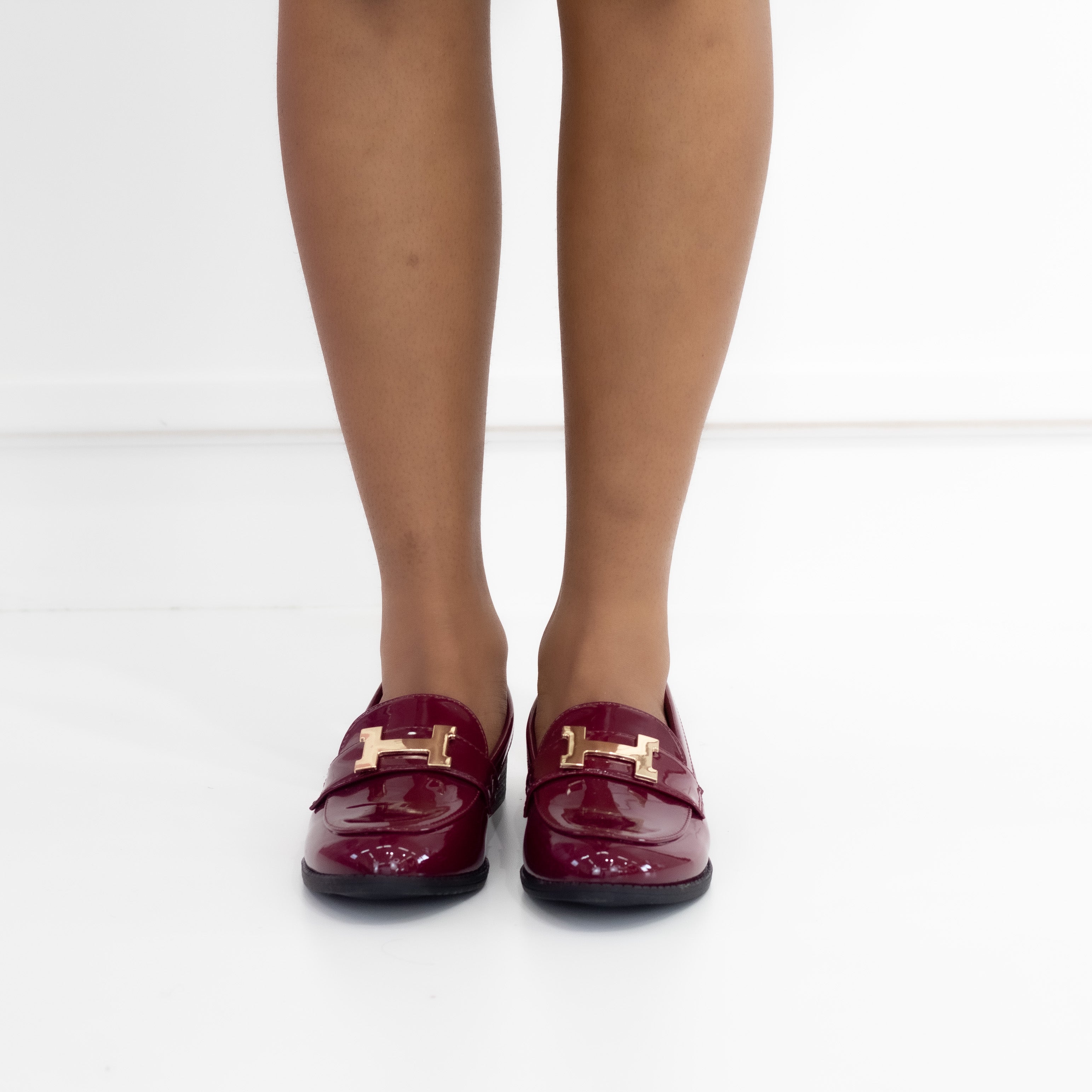 Mishal flat loafer in pat pu with gold trim wine