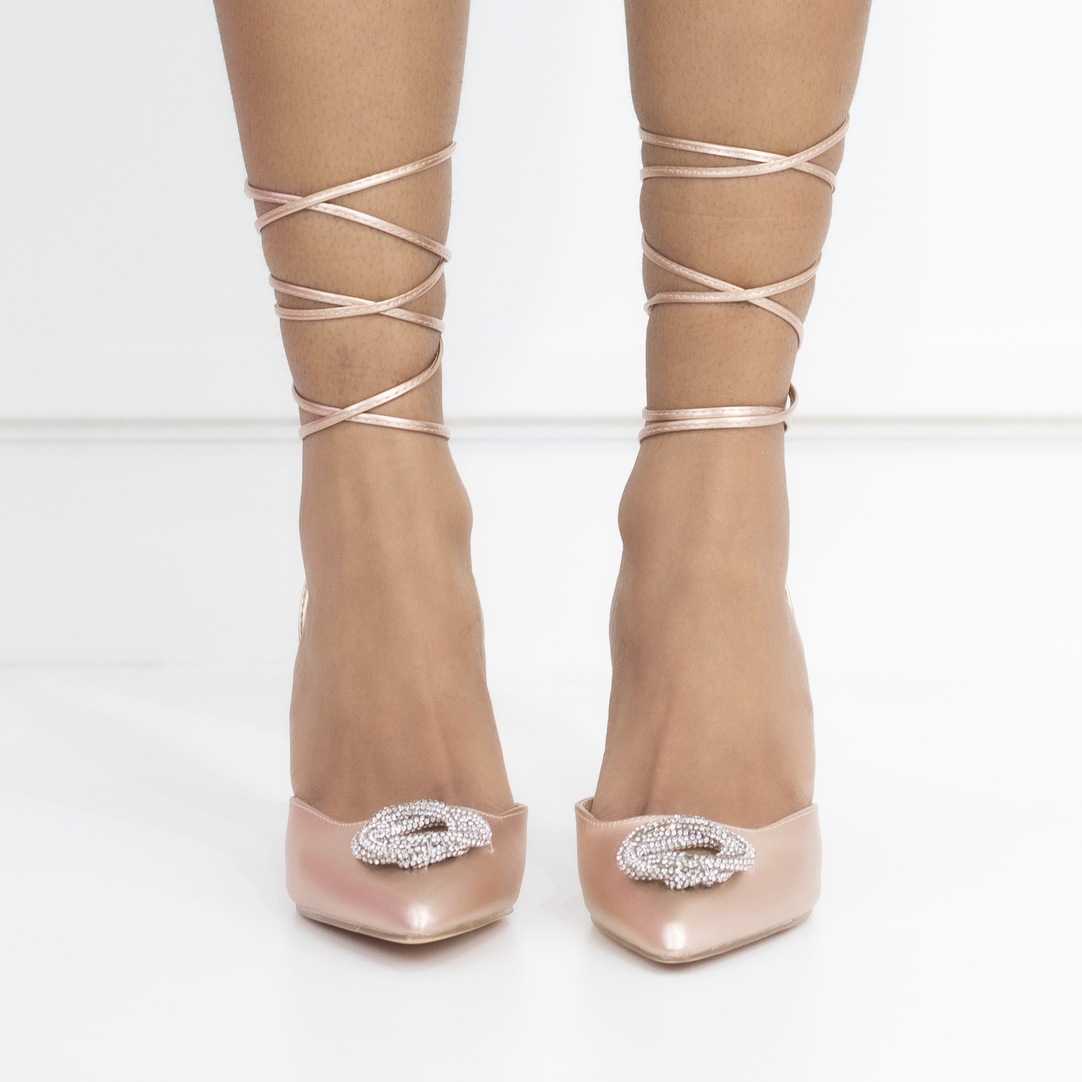 Champagne tie up pointy heel with a round diamond trim cupid