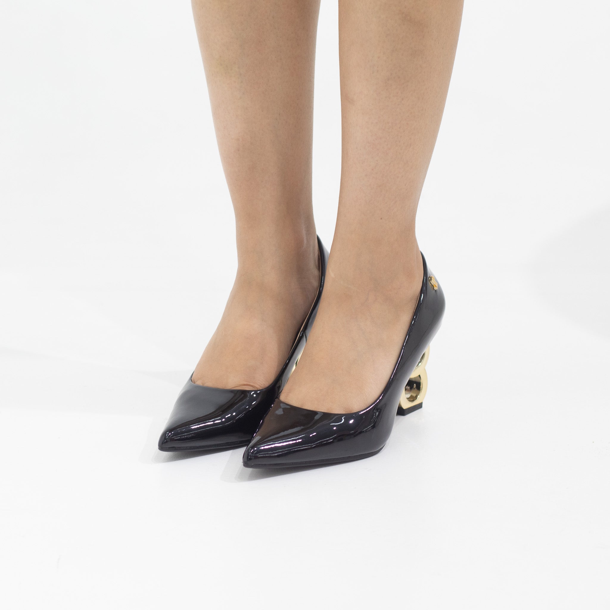Black heels with gold circle heel