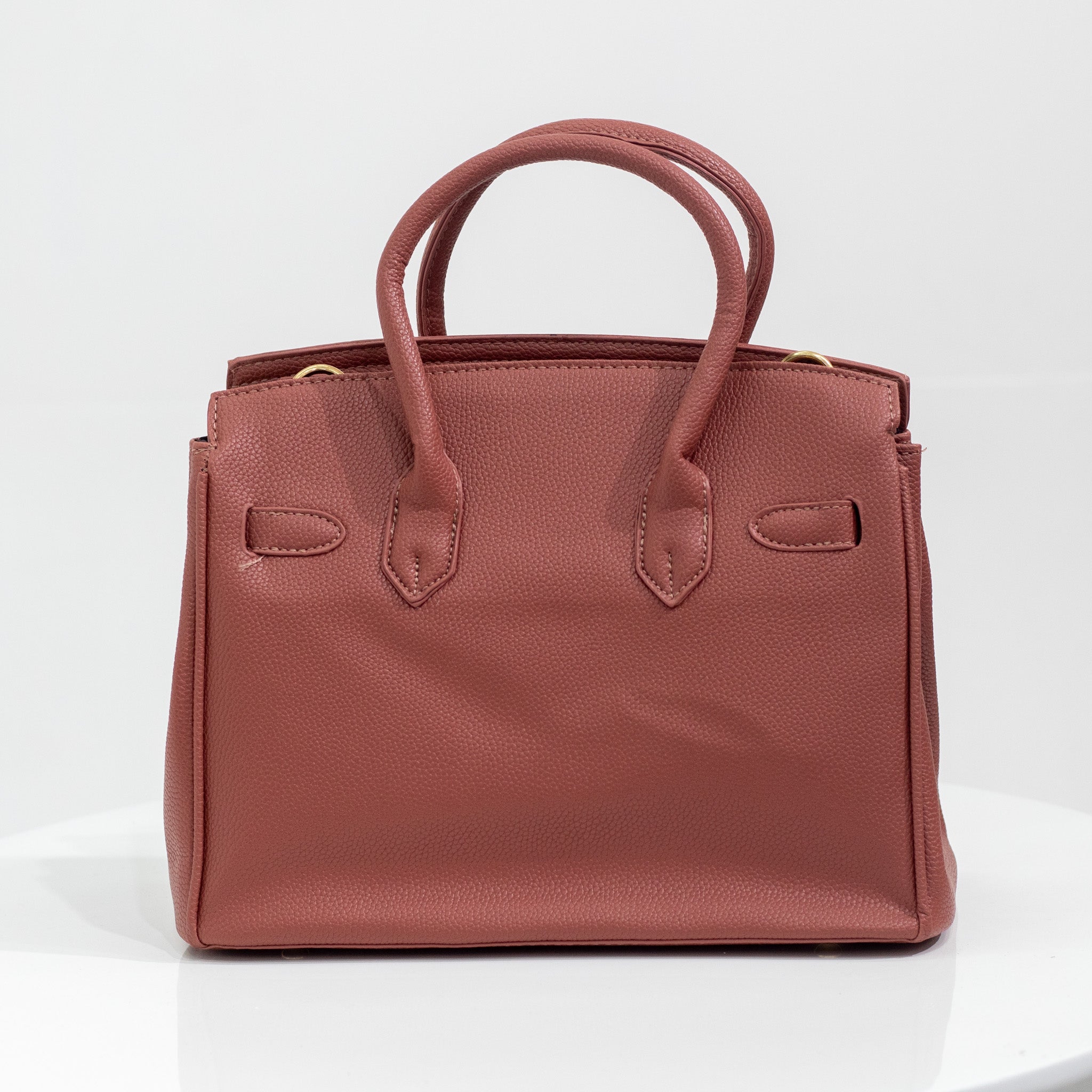 Blush faux leather hand bag quincy