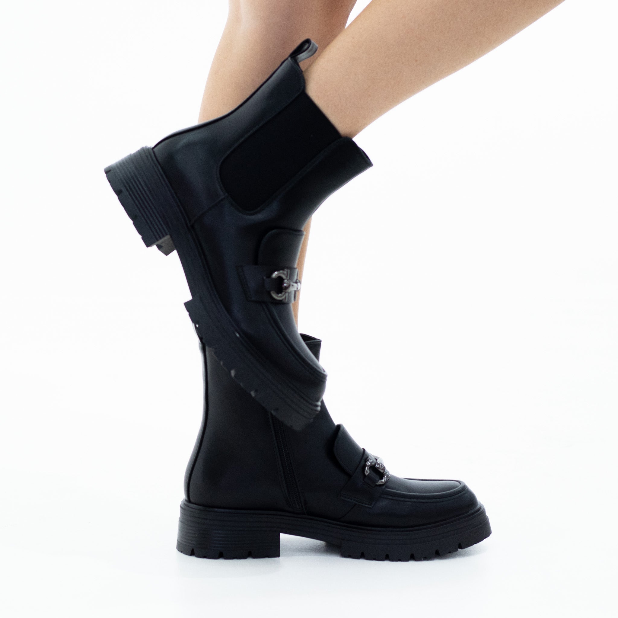 Black 4cm heel chuncky clerated chelse boot with a trim wilea